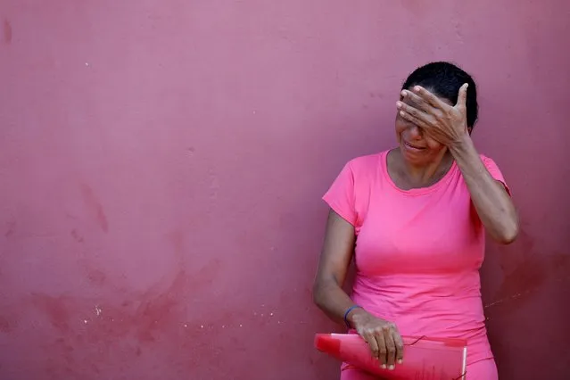 A relative of a prisoner cries after a prison riot, in front of the Medical Legal Institute of Altamira, Brazil, July 30, 2019. (Photo by Bruno Kelly/Reuters)