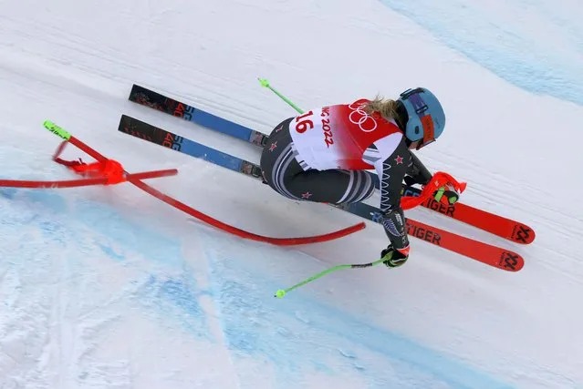 Alice Robinson, of New Zealand crashes into a flag during the women's super-G at the 2022 Winter Olympics, Friday, February 11, 2022, in the Yanqing district of Beijing. (Photo by Alessandro Trovati/AP Photo)