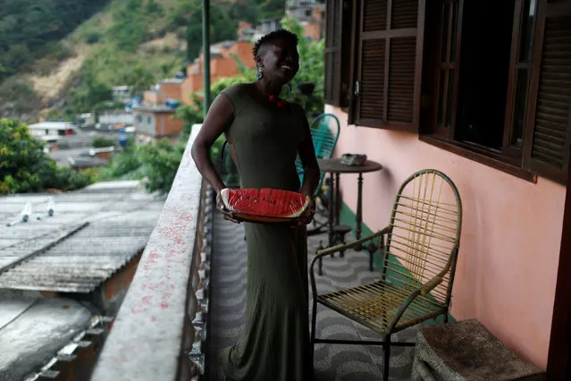 Solange, a worker at Pousada Favelinha (Little favela) hostel, poses for a photograph at the hostel in Pereira da Silva favela, in Rio de Janeiro, Brazil, April 29, 2016. (Photo by Pilar Olivares/Reuters)