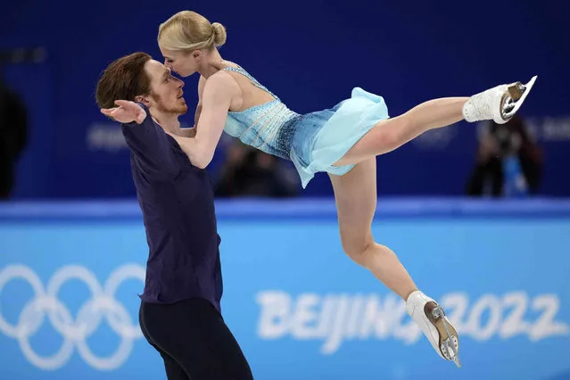 Evgenia Tarasova and Vladimir Morozov, of the Russian Olympic Committee, compete in the pairs short program during the figure skating competition at the 2022 Winter Olympics, Friday, February 18, 2022, in Beijing. (Photo by Bernat Armangue/AP Photo)