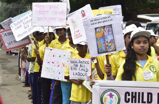 Students join a rally as part of the World Day Against Child Labour in Guwahati, India on June 12, 2024. (Photo by Dasarath Deka/ZUMA Press Wire/Rex Features/Shutterstock)
