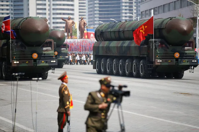 Missiles are driven past the stand with North Korean leader Kim Jong Un and other high ranking officials during a military parade marking the 105th birth anniversary of country's founding father Kim Il Sung, in Pyongyang April 15, 2017. (Photo by Damir Sagolj/Reuters)