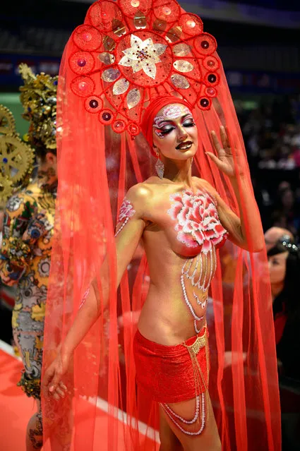 A model poses on the catwalk after the contest “Body Painting” of the OMC Hairworld World Cup on May 4, 2014 in Frankfurt am Main, Germany. The OMC Hairworld World Cup will be held in Frankfurt from 3 to 5 May 2014, parallel to the Hair and Beauty 2014 fair. Around 1.250 participants from 50 countries fight in different contest for the titles. (Photo by Thomas Lohnes/Getty Images)