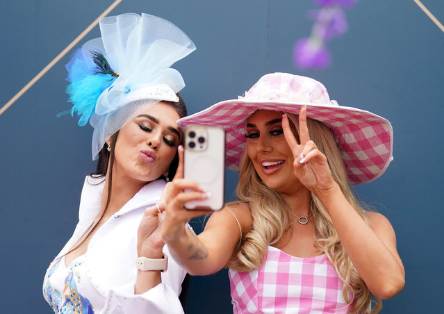 Racegoers Louise Foley and Lizzie Dagnell during day two of the Randox Grand National Festival at Aintree Racecourse, Liverpool on Friday, April 14, 2023. (Photo by Mike Egerton/PA Images via Getty Images)