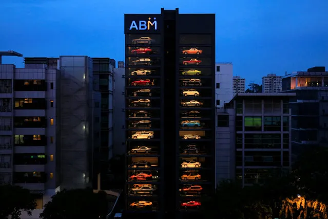 An exotic used car dealership designed to resemble a vending machine in Singapore May 15, 2017. The dealership houses up to 60 exotic cars in a 15 storey building which uses a fish-bone type lift system to deliver cars to clients within minutes. (Photo by Thomas White/Reuters)