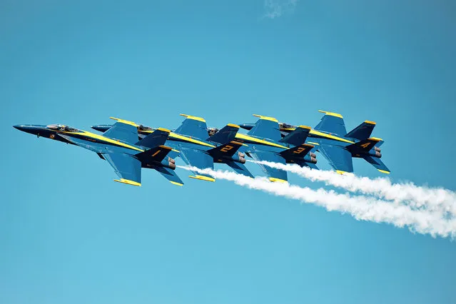 The U.S. Navy Flight Demonstration Squadron, Blue Angels, perform aerial manuevers during the Titans of Flight Air Expo, Joint Base Charleston, South Carolina, April 8, 2022. The airshow showcases more than 50 aerial demonstration performances and static aircraft displays. (Photo by Senior Airman Bailee A. Darbasie/U.S. Air Force/Capture Media Agency)