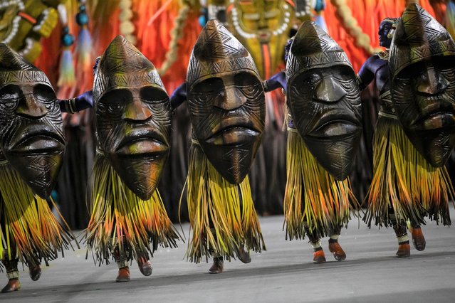 Performers from the Vila Isabel samba school parade on a float during Carnival celebrations at the Sambadrome in Rio de Janeiro, Brazil, Sunday, April 24, 2022. (Photo by Bruna Prado/AP Photo)