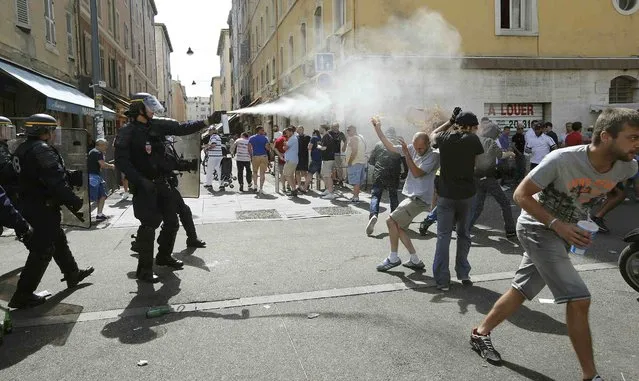 Football Soccer, Euro 2016, England vs Russia, Group B, Stade Velodrome, Marseille, France on June 11, 2016. Police use teargas on supporters near port of Marseille before the game. (Photo by Jean-Paul Pelissier/Reuters)