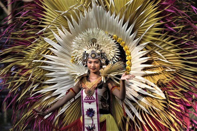 Balinese artists take parts during the cultural parade of the Bali Arts Festival in Denpasar, Bali, Indonesia on June 18, 2023. In order to preserve culture heritage and promote tourism, the annual festival will showcase diverse array of Balinese arts and traditional performances throughout the month. This event holds great significance as Indonesia enters the endemic stage of the Covid-19. (Photo by Johannes P. Christo/Anadolu Agency via Getty Images)