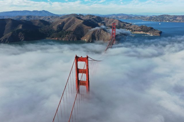 An aerial view of the Golden Gate Bridge is seen with fog in San Francisco, California, United States on October 29, 2021. (Photo by Tayfun Coskun/Anadolu Agency via Getty Images)