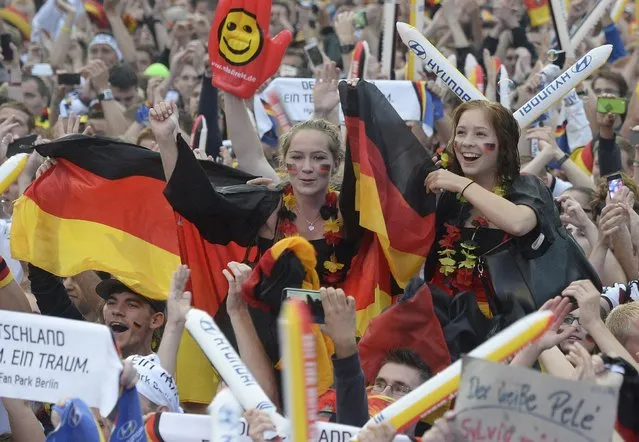 Fans of Germany cheer as they watch the 2014 World Cup final between Germany and Argentina in Brazil at a public screening of the match in Berlin July 13, 2014. (Photo by Fabian Bimmer/Reuters)
