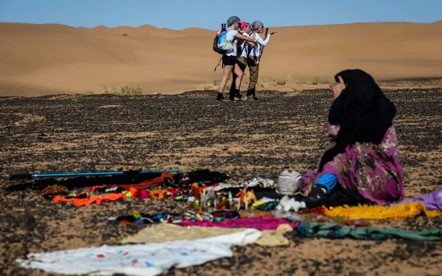 Women take part in the desert trek “Rose Trip Maroc”, on November 1, 2019 in the erg Chebbi near Merzouga. The Rose Trip Maroc is a female-oriented trek where teams of three must travel through the southern Moroccan Sahara desert with a compass, a map and a topographical reporter. (Photo by Jean-Philippe Ksiazek/AFP Photo)