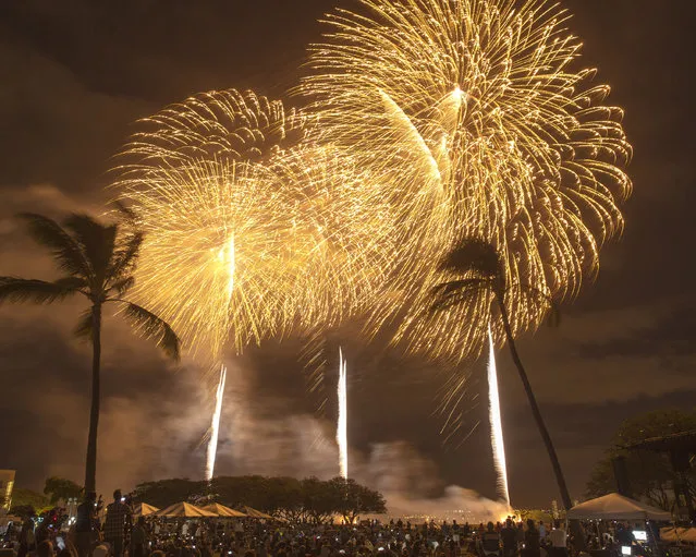 Fireworks from Nagaoka City, Japan, explode over Ford Island to celebrate the 70th anniversary of the end of World War II at Joint Base Pearl Harbor-Hickam Hawaii, Saturday, August 15, 2015, in Honolulu. (Photo by Marco Garcia/AP Photo)
