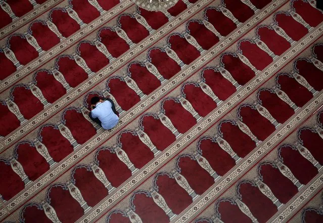 A Muslim man sits inside a mosque during the holy fasting month of Ramadan in Jakarta, Indonesia June 30, 2016. (Photo by Darren Whiteside/Reuters)