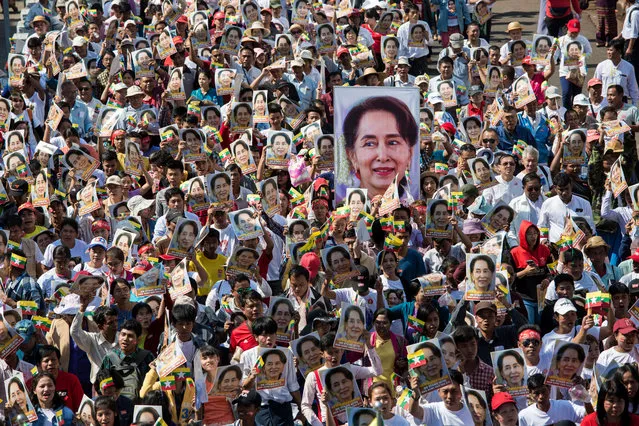 People participate in a rally in support of Myanmar's State Counsellor Aung San Suu Kyi, as she prepares to defend Myanmar at the International Court of Justice in The Hague against accusations of genocide against Rohingya Muslims, in Yangon on December 10, 2019. Nobel peace laureate Aung San Suu Kyi is set on December 10 to personally defend Myanmar in The Hague against accusations of genocide, in a remarkable fall from grace for the woman once hailed as a rights icon. (Photo by Sai Aung Main/AFP Photo)