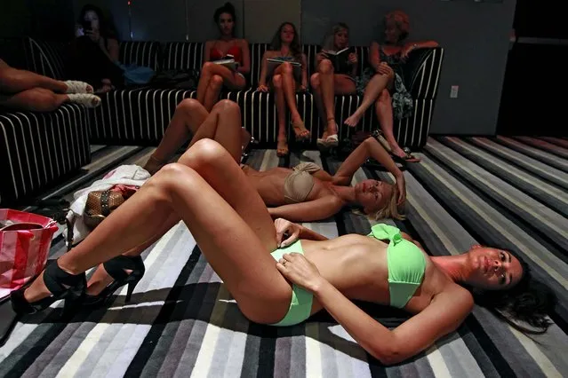 Model Brittany Churchill of Toronto lays on the floor at the W South Beach as she waits to walk for a casting for the Friday night opening party of Salon Allure during Mercedes-Benz Fashion Week Swim. (Charles Trainor Jr./The Miami Herald)