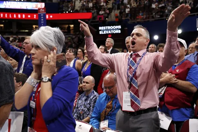 A Republican National Convention delegate puts her fingers in her ears as other delegates scream and yell after the temporary chairman announced that the convention will not hold a roll-call vote on the Republican National Convention Rules Committee's report and rules changes and rejected the efforts of anti-Trump forces to hold such a vote, at the Republican National Convention in Cleveland, Ohio, U.S. July 18, 2016. (Photo by Mark Kauzlarich/Reuters)