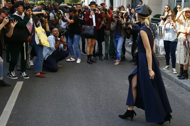 A fashion guest poses in the street after Christian Dior Spring/Summer 2018 ready-to-wear fashion collection presented in Paris, Tuesday, September 26, 2017. (Photo by Francois Mori/AP Photo)