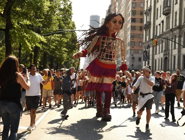 Little Amal, the 12-foot-tall Syrian refugee puppet, who represents all displaced children visted Licoln Center and walked the streets of Manhattan making her way to the American Museum of Natural History in New York on September 17, 2022. (Photo by Photo Image Press/Rex Features/Shutterstock)