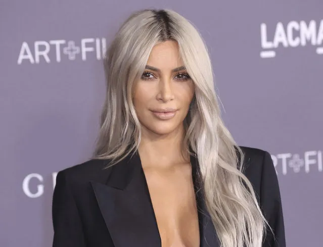 In this November 4, 2017 file photo, Kim Kardashian West arrives at the LACMA Art + Film Gala at the Los Angeles County Museum of Art in Los Angeles. West is promoting Screenshop, which dishes up a range of shoppable fashion and accessory options based on a phone screen grab a user takes from social media or anywhere else. (Photo by Willy Sanjuan/Invision/AP Photo)