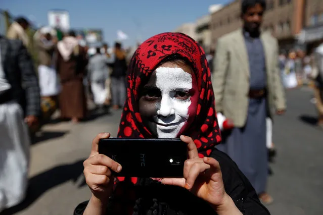A Yemeni youth takes part in a demonstration calling for the Saudi- led coalition' s blockade to be lifted, on November 13, 2017, in the rebel- held capital Sanaa The coalition shut down Yemen' s borders on November 6 in response to a missile attack by Huthi rebels that was intercepted near Riyadh airport. (Photo by AFP Photo/Stringer)