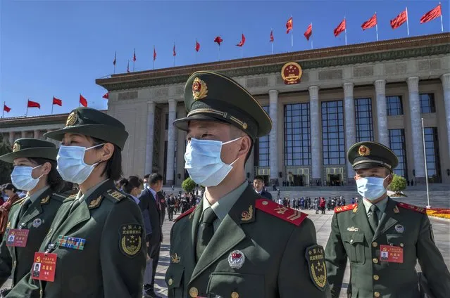 Military delegates leave after the Opening Ceremony of the 20th National Congress of the Communist Party of China  at The Great Hall of People on October 16, 2022 in Beijing, China. Chinese President Xi Jinping is widely expected to secure a third term in power. (Photo by Kevin Frayer/Getty Images)