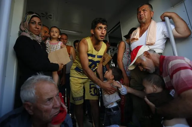 Migrants wait inside a train at the station in Beli Manastir, Croatia September 18, 2015. (Photo by Laszlo Balogh/Reuters)
