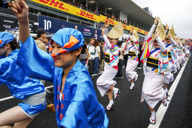 Japanese dancers perform the Awa-odori in the pitlane during the driver parade before the 2025 Formula 1 Japanese Grand Prix at the Suzuka Circuit, in Suzuka, Japan, 06 April 2025. (Photo by Franck Robichon/EPA)