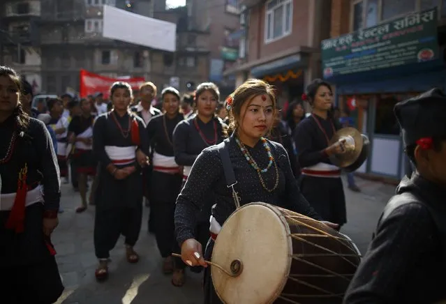 Women, in traditional attire, play instruments during the Newari New Year parade that falls during the Tihar festival, also called Diwali, in Kathmandu October 24, 2014. (Photo by Navesh Chitrakar/Reuters)