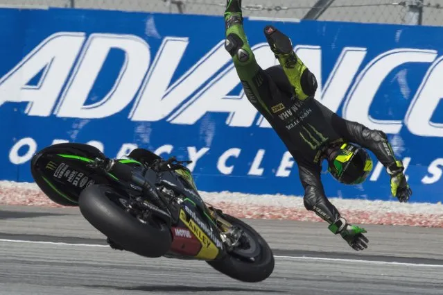 Pol Espargaro of Spain and Monster Yamaha Tech 3 crashes out during the MotoGP Of Malaysia - Qualifying at Sepang Circuit on October 25, 2014 in Kuala Lumpur, Malaysia. (Photo by Mirco Lazzari gp/Getty Images)