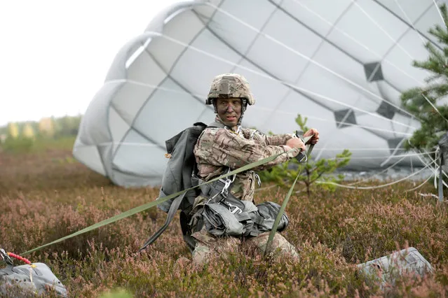 A U.S. paratrooper of the 173rd Airborne Brigade takes part in sky jump “Bayonet Strike” excercise in Adazi, Latvia, September 12, 2016. (Photo by Ints Kalnins/Reuters)