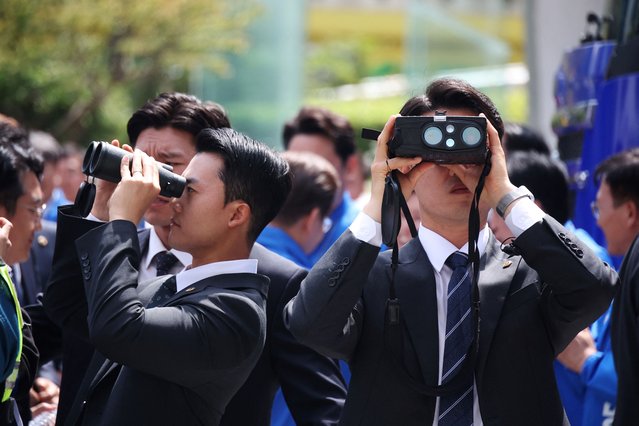 Security personnel stand guard as Lee Jae-myung, the presidential candidate for South Korea's Democratic Party, arrives for an election campaign rally in Seoul, South Korea, on May 19, 2025. (Photo by Kim Hong-Ji/Reuters)