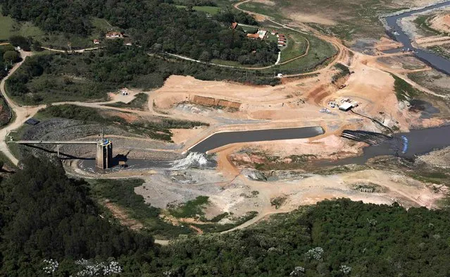 An aerial view shows the Jaguari dam station, part of the Cantareira reservoir, during a drought in Braganca Paulista, Sao Paulo state November 18, 2014. (Photo by Nacho Doce/Reuters)
