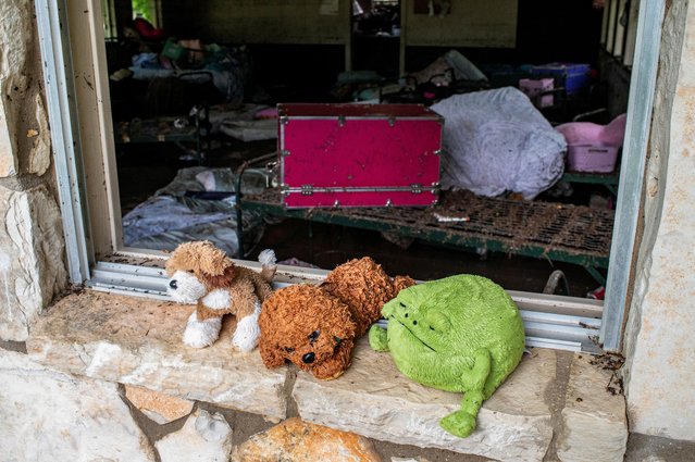 Stuffed animals sit in a windowsill at Camp Mystic after a deadly flooding in Kerr County, Texas, on July 5, 2025. (Photo by Sergio Flores/Reuters)