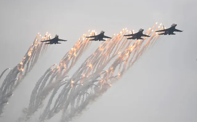 Su-30MK2 fighter jets of Vietnam People's Army Air Force fly during the Vietnam 2022 International Defense Expo in Hanoi on December 8, 2022 (Photo by Nhac Nguyen/AFP Photo)