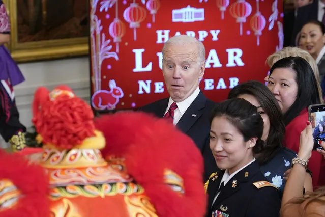 President Joe Biden reacts to a performer during a reception to celebrate the Lunar New Year in the East Room of the White House in Washington, Thursday, January 26, 2023. (Photo by Susan Walsh/AP Photo)