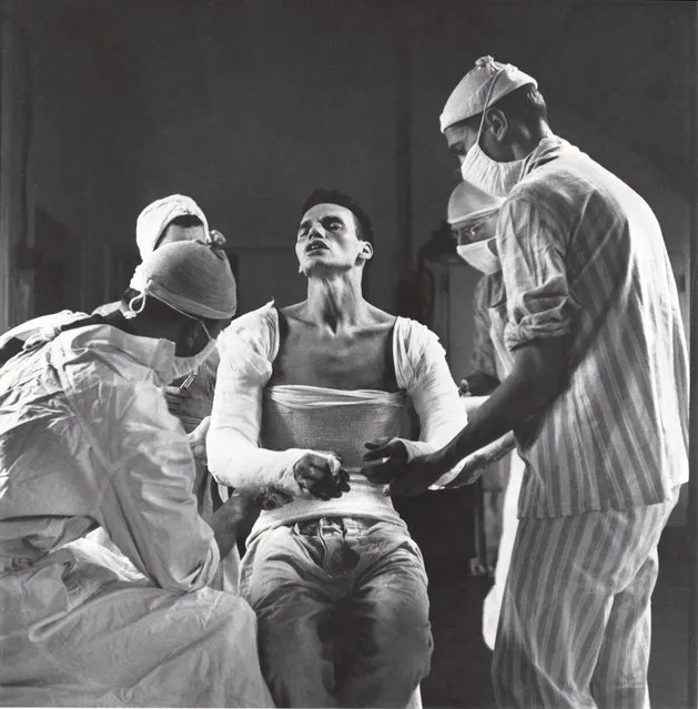 Army medic George Lott, wounded in both arms in November, 1944, grimaces as doctors mold a cast to his body. When Lott embarked on a 4,500-mile, seven-hospital journey of recovery, photographer Ralph Morse – astonished by the high level of medical care wounded troops received both at the front and behind the lines – traveled with him, and chronicled Lott's odyssey in a revelatory cover story for LIFE. (Photo by Ralph Morse/Time & Life Pictures)