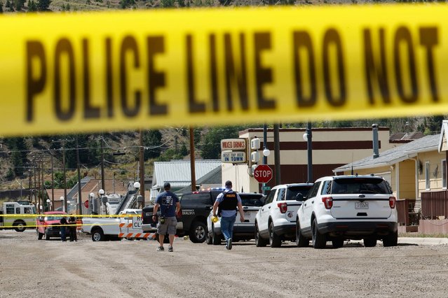 Police and other emergency personnel are seen after a shooting in Anaconda, Montana, on Friday, August 1, 2025. Investigators say Army veteran Michael Paul Brown has been on the run since Friday after gunning down a bartender and three patrons at The Owl Bar in Anaconda – a community of less than 10,000 people nestled between the dense forests and formidable mountains of western Montana. (Photo by Joseph Scheller/The Montana Standard/AP Photo)