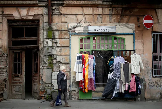 A woman passes by a second hand shop in Tbilisi, Georgia, February 16, 2018. (Photo by David Mdzinarishvili/Reuters)