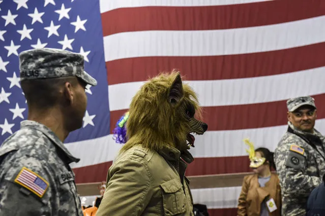 A U.S soldier wearing a werewolf mask takes part in a Halloween party at the US military camp Bondsteel near the town of Ferizaj on October 30, 2015. (Photo by Armend Nimani/AFP Photo)