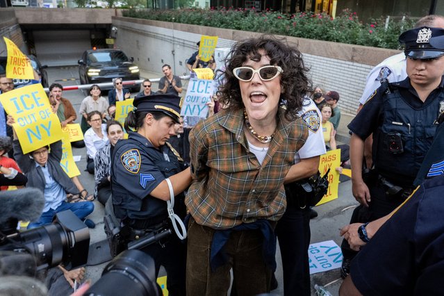 New York City Police Department (NYPD) officers detain a person during a protest against Immigration and Customs Enforcement (ICE) outside U.S. immigration court in Manhattan, New York City, U.S., September 18, 2025. (Photo by David 'Dee' Delgado/Reuters)