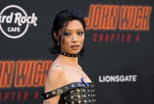 Japanese and British singer-songwriter Rina Sawayama, a cast member in “John Wick: Chapter 4”, looks back for photographers at the premiere of the film, Monday, March 20, 2023, at the TCL Chinese Theatre in Los Angeles. (Photo by Chris Pizzello/AP Photo)