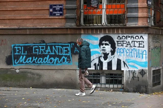 A mural of Diego Maradona that reads “Dorcol, Brother, Argentina” is painted on a wall in in Dorcol neighbourhood on November 30, 2020 in Belgrade, Serbia. Former footballer Diego Maradona died at the age of 60 after a cardiac arrest while he was at his house in Tigre, Argentina, where he was spending his convalescence after brain surgery three weeks before. (Photo by Milos Miskov/Anadolu Agency via Getty Images)