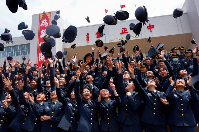 Cadets pose for group photos at the graduation ceremony of their military academies in Taipei, Taiwan on June 27, 2024. (Photo by Ann Wang/Reuters)