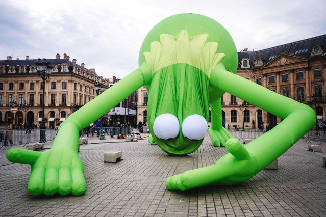 This photograph shows installing of the artwork of Venezuelan-US artist Alex Da Corte titled “Kermit the Frog, Even” at Place Vendome in Paris, on October 19, 2025, ahead of the official opening of the Art Basel contemporary and modern art market. (Photo by Dimitar Photo)