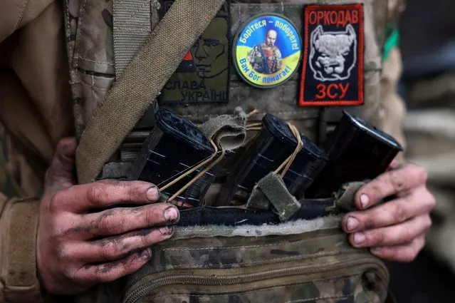 Ukrainian artillery unit operates from muddy trenches near the frontline during heavy fighting amid Russia's attack on Ukraine, close to Bakhmut, Ukraine on April 13, 2023. (Photo by Kai Pfaffenbach/Reuters)