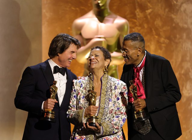 From left, actor Tom Cruise, actress and choreographer Debbie Allen and production designer Wynn Thomas hold the honorary Academy Awards they received at the Governor Awards in Hollywood on Sunday, November 16, 2025. They were recognized for their contributions to cinema over the years. (Photo by Kevin Winter/Getty Images)