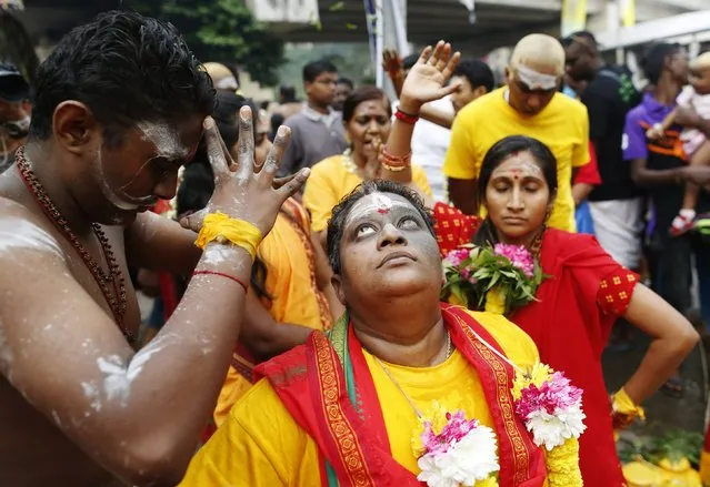 Hindu devotees go into a trance before starting their pilgrimage to the Batu Caves temple during Thaipusam in Kuala Lumpur February 2, 2015. (Photo by Olivia Harris/Reuters)