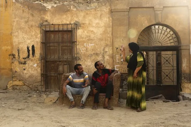 Residents talk in an alley inside the Cairo Necropolis, Egypt, September 14, 2015. (Photo by Asmaa Waguih/Reuters)