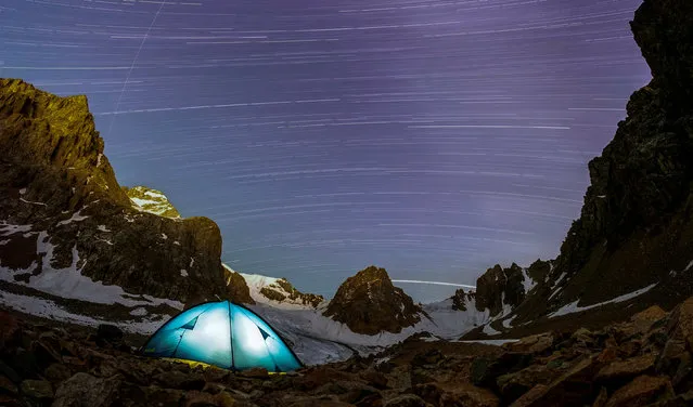 A long exposure picture shows stars and meteor trails above the mountains of Tien Shan, outside Almaty, Kazakhstan July 22, 2018. (Photo by Shamil Zhumatov/Reuters)
